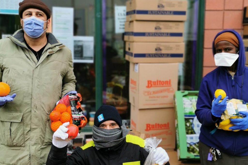 People standing with boxes of food