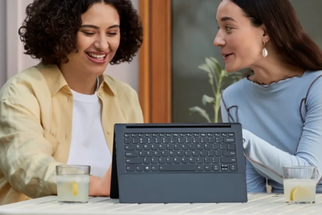 Two women working together on a tablet computer