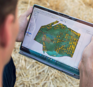 A person holding a tablet that shows a map