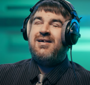 Accessibility consultant Brandon Cole wearing a set of headphones