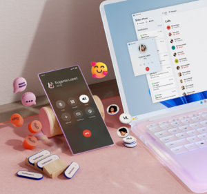 iPhone next to a Windows 11 laptop computer