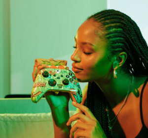 Woman smelling the new pizza-scented Xbox controller