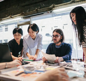 Coworkers reviewing photographs