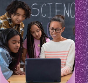 A teacher and three of her teenaged students share a laptop computer