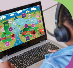 Student wearing headphones looks at a game on his laptop