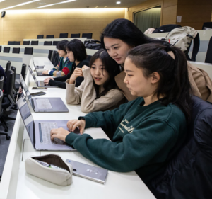 Teacher with students in a lecture hall