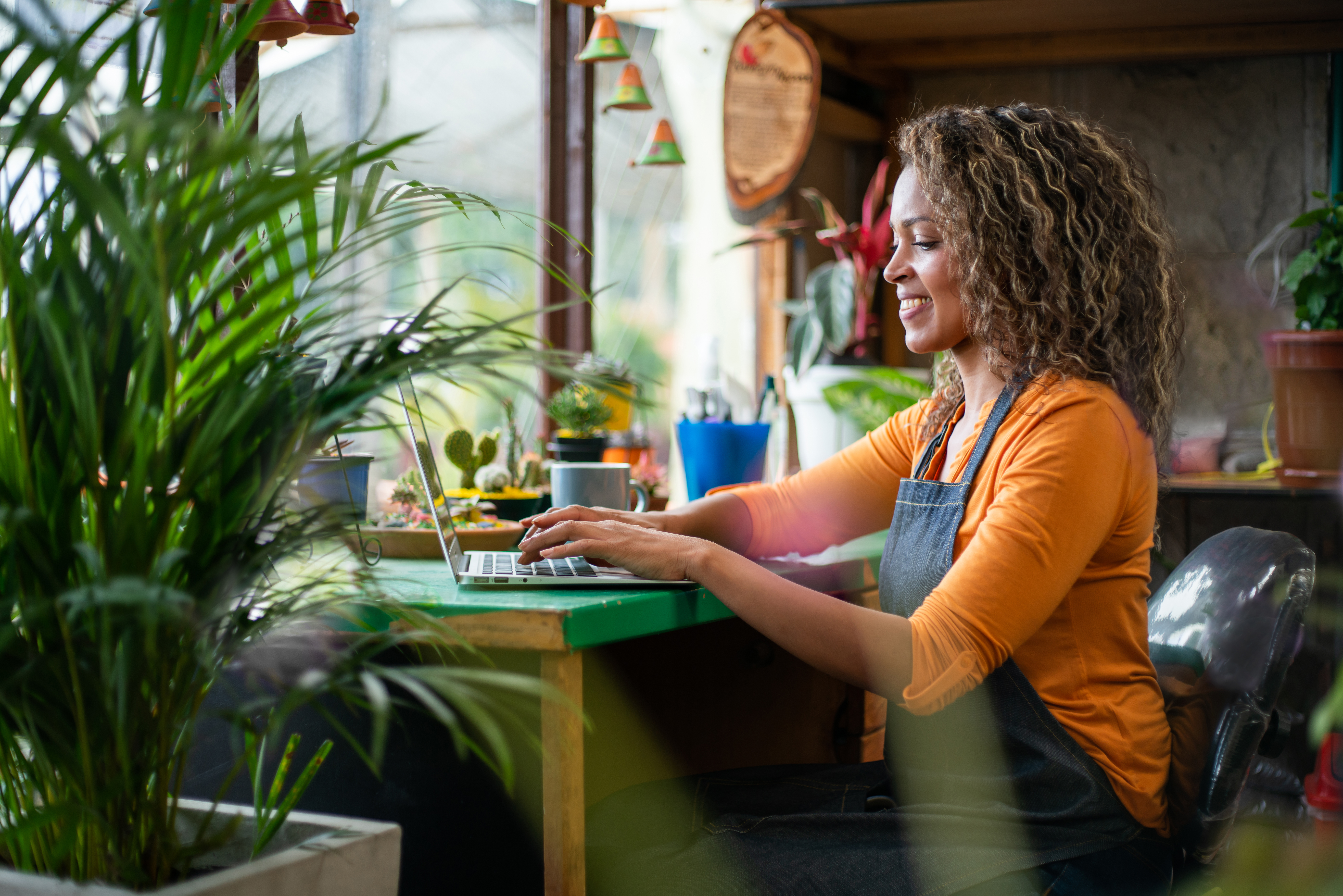 Photo of someone working at a computer in a flower shop