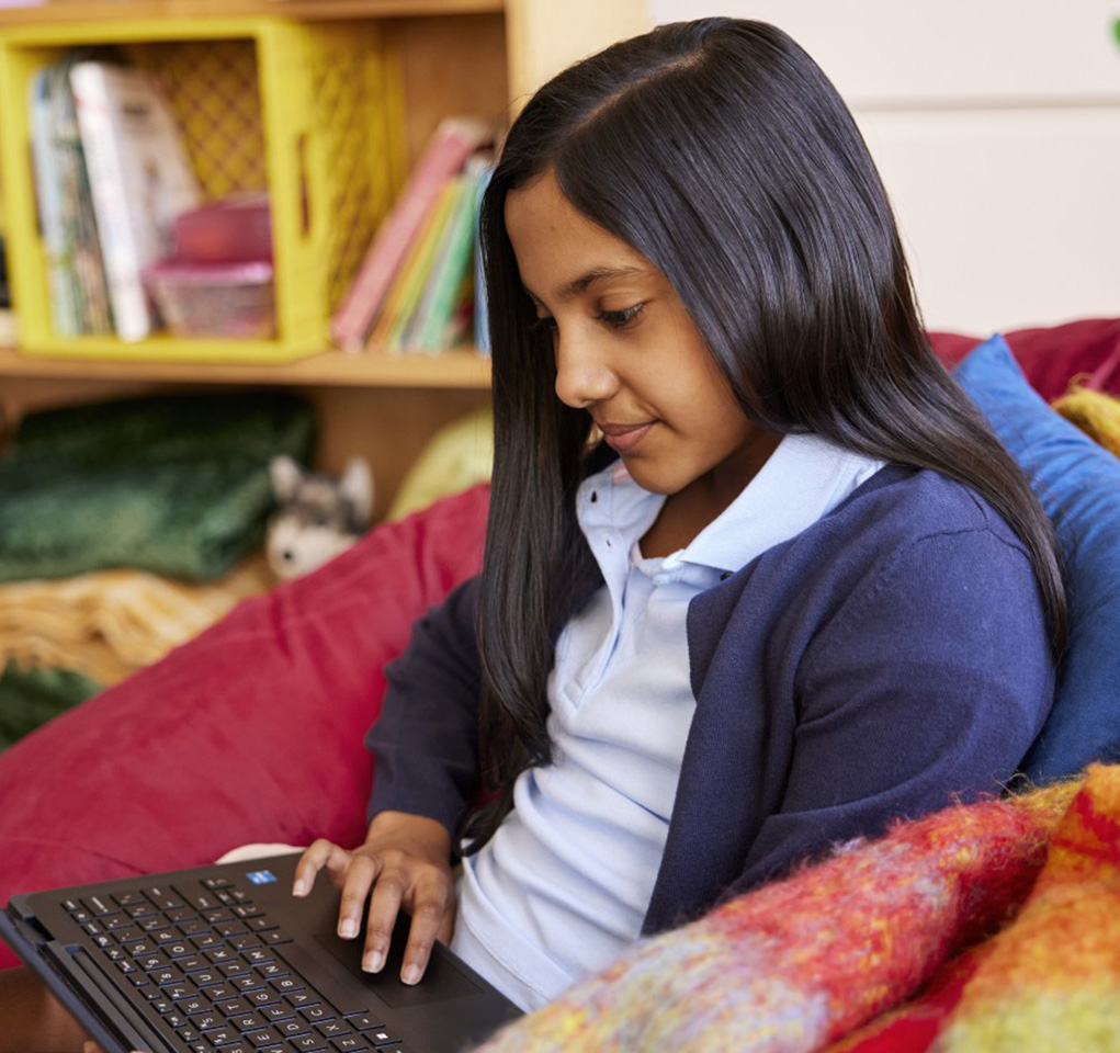 Girl working at a laptop computer