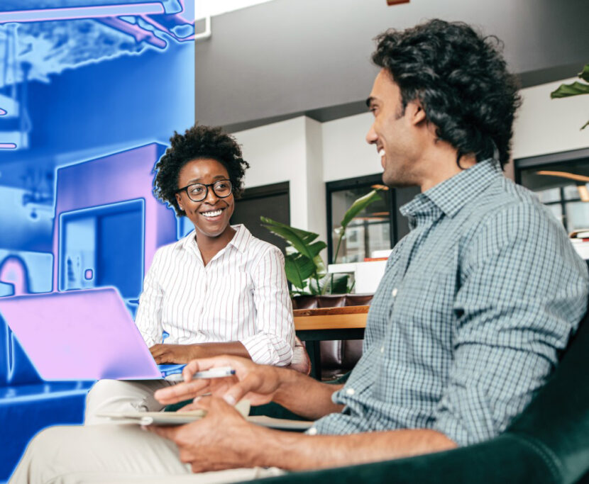 Woman and man conversing in an office environment.
