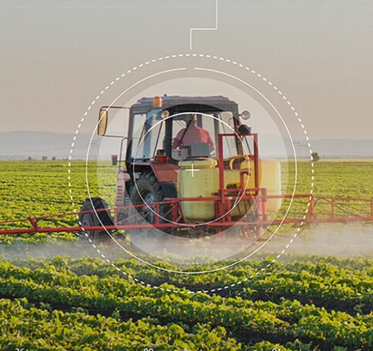 Farm equipment being driven by a farmer