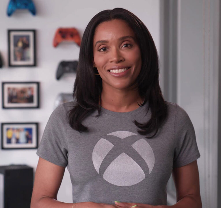 Woman wearing a T-shirt with the Xbox logo.