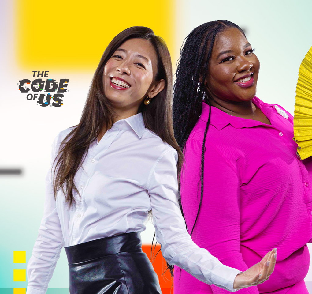 Two women smiling, one holding a fan., along with the words "The code of us."