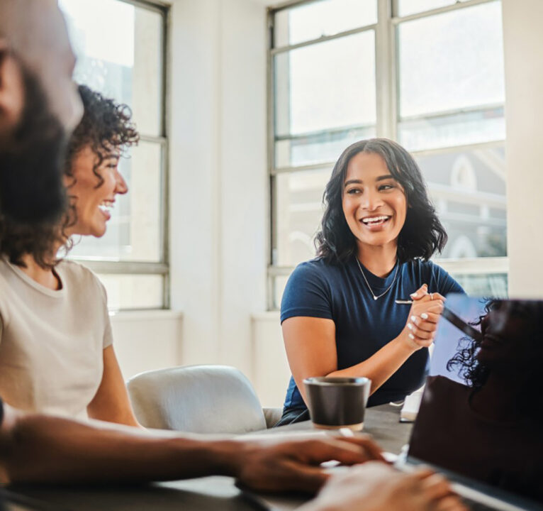 Three people in a meeting.